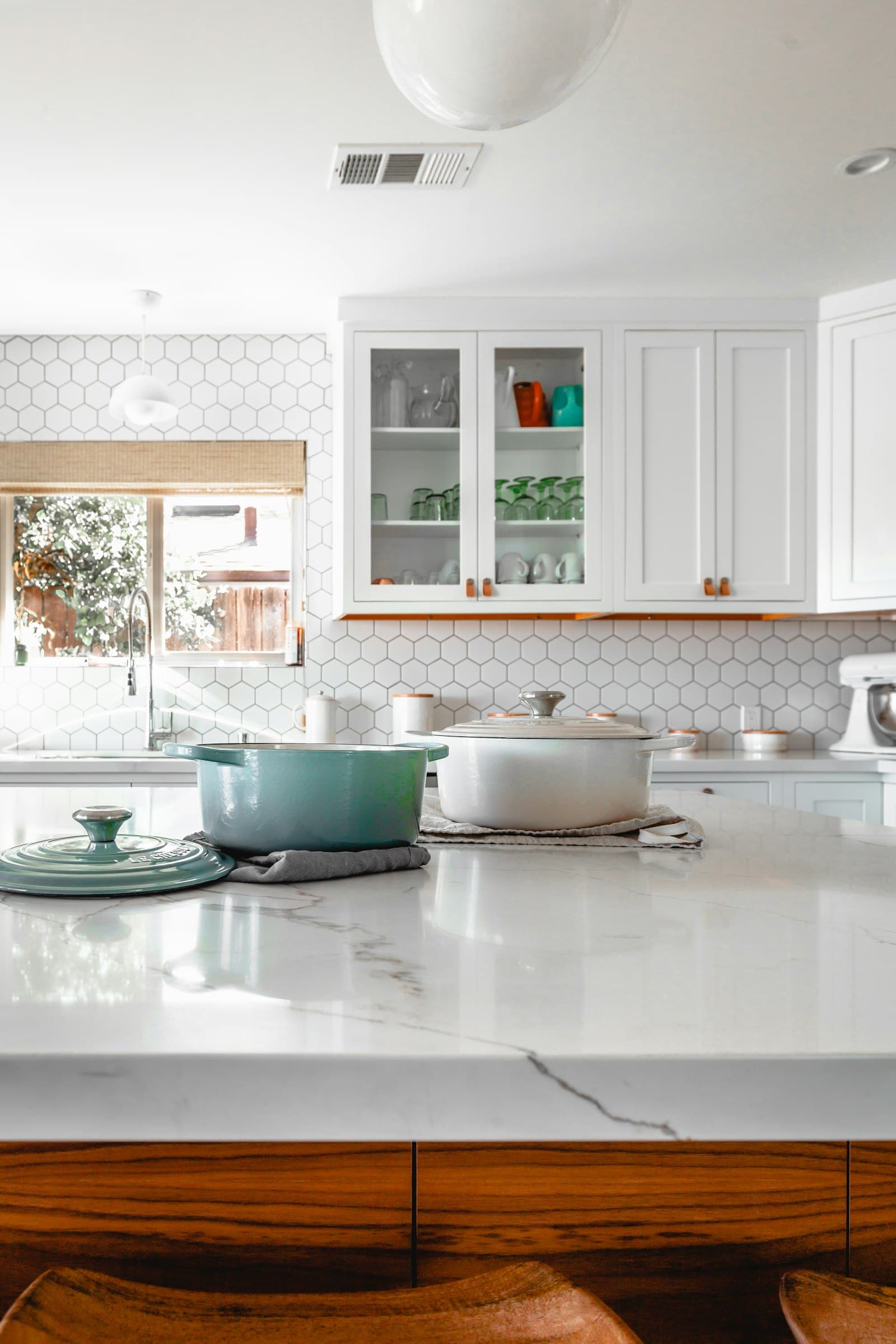 Finished Naperville kitchen remodel with white cabinets and wood island